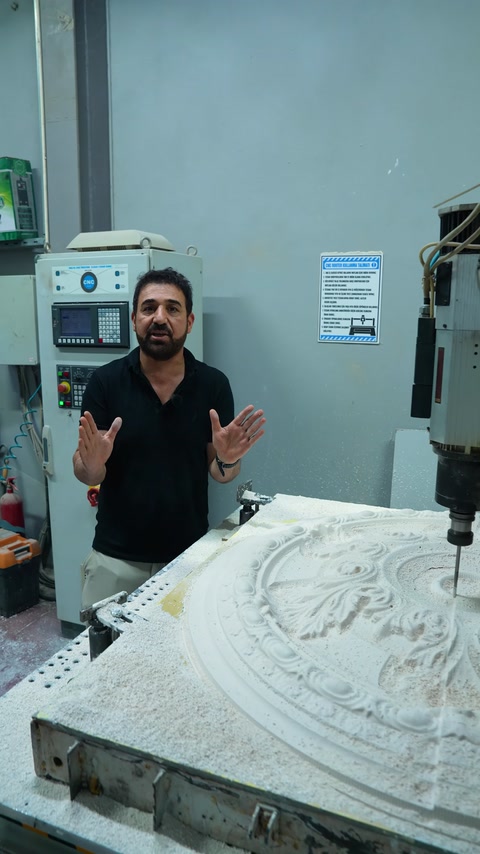 The cutting tool performs detailed machining on the embossed surface of the ceiling medallion mold.
