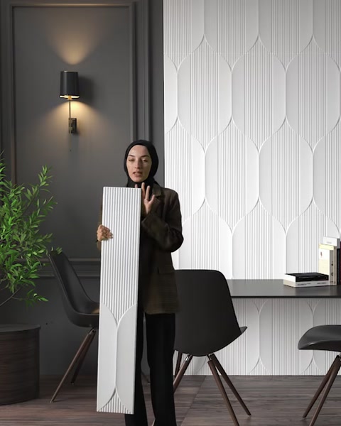 A grooved panel surface and a geometric wall covering are compared
