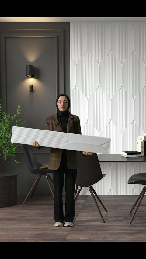 Il pannello decorativo viene ruotato orizzontalmente per mostrare l'ampia superficie nell'ambiente dell'ufficio moderno.