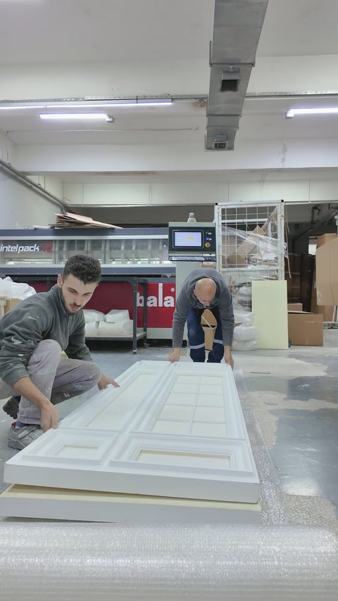 Completed panel section rests horizontally before protective wrapping