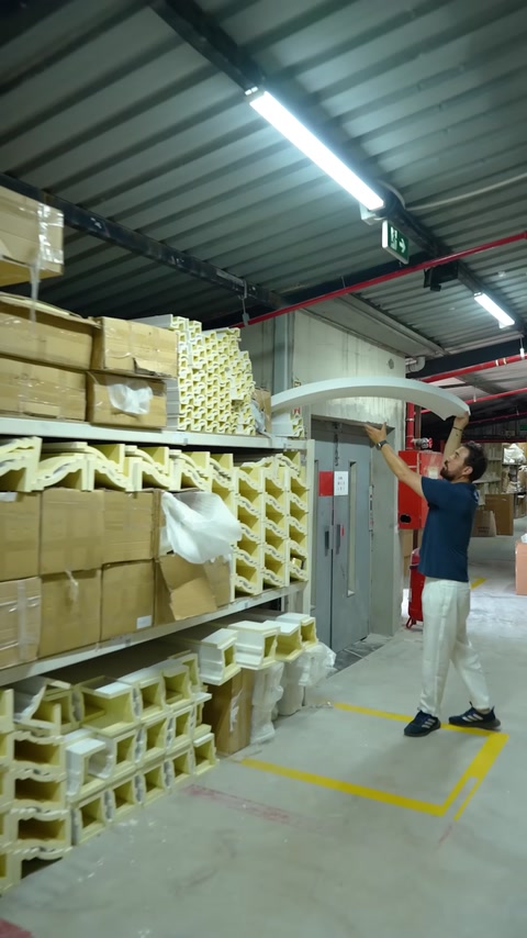 Arch-shaped decorative profile is taken from warehouse shelf