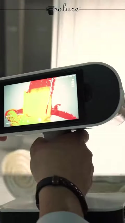 Scanning data is displayed on the device screen as a colored surface model