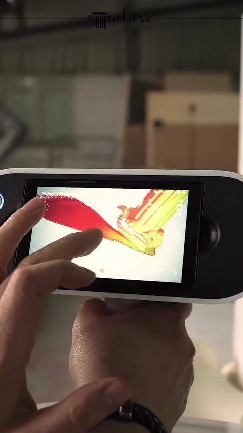 The curved form of the column pedestal is checked on the digital model