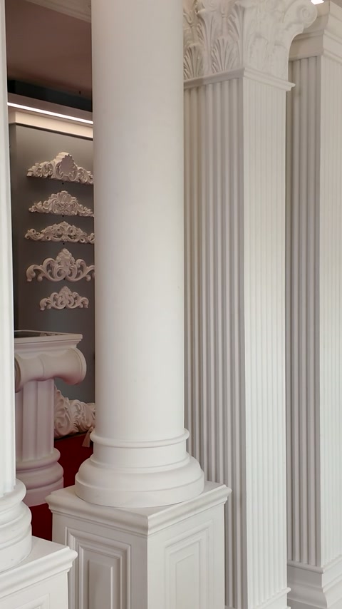 Ornate capitals and fluted columns displayed inside the product showroom
