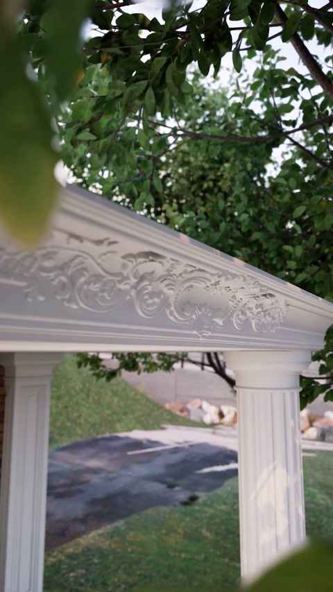 Decorative floral pediment adds relief above the exterior column structure