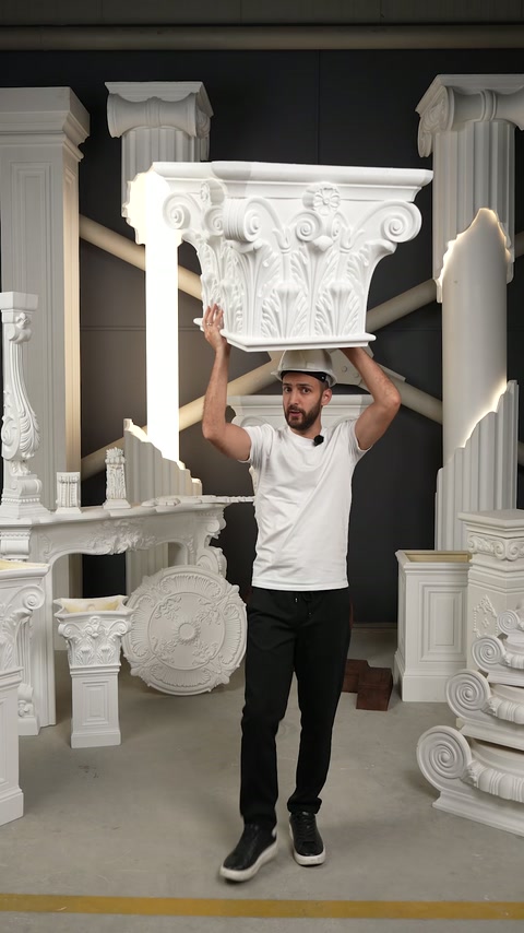 Craftsman presents a large Corinthian capital inside the production showroom