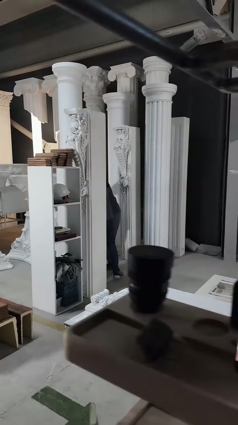Video shows decorative column and entrance cornice application in a workshop.