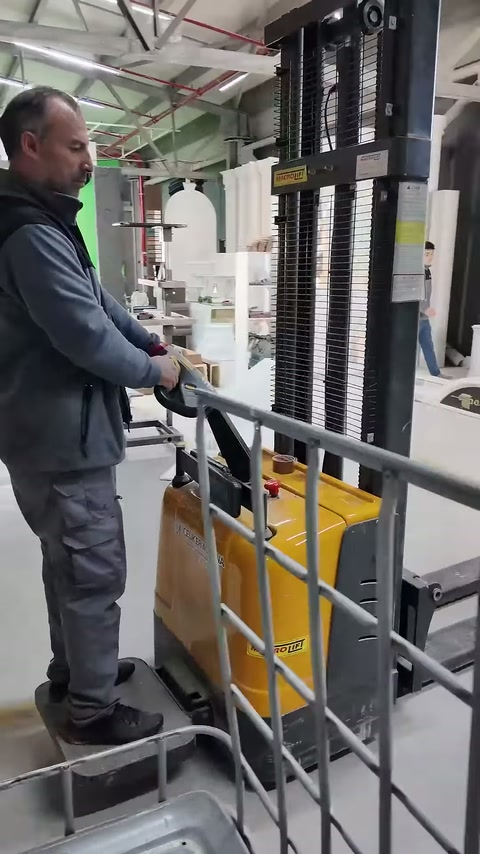 Operator drives the lifting machine toward the area where columns are located.