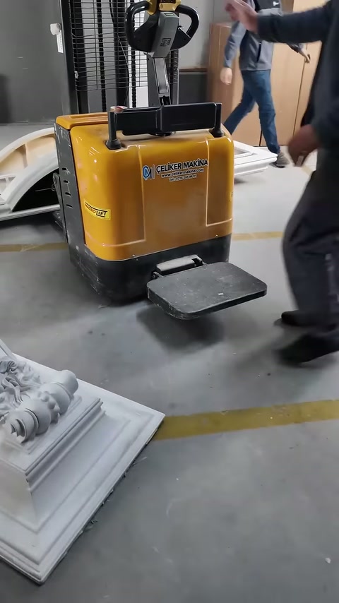 Operator climbs onto the platform of the standing lifting machine.