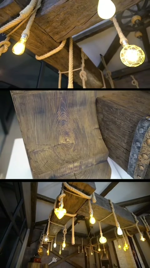 In un ambiente rustico si presentano lampade a corda e dettagli di travi con texture legno