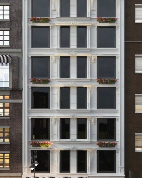 Multi-story building facade decorated with polyurethane window cornices.