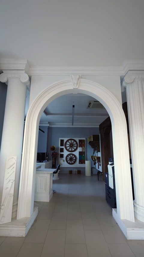 Interior arched doorway framed with polyurethane column mouldings.