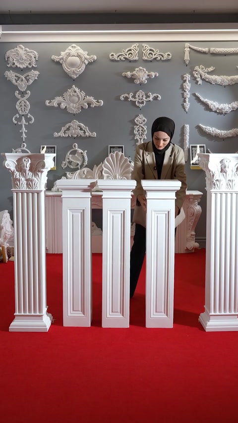 Row of finished polyurethane pedestal columns in a display room