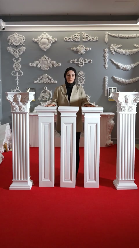 Multiple short pedestal designs stand assembled across the showroom display.
