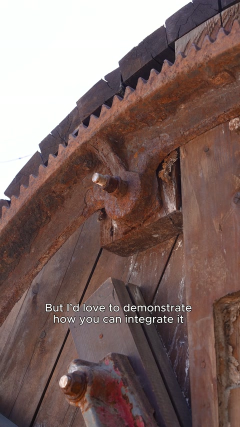 Rustic eaves, joints, and carved details on the wooden body are shown