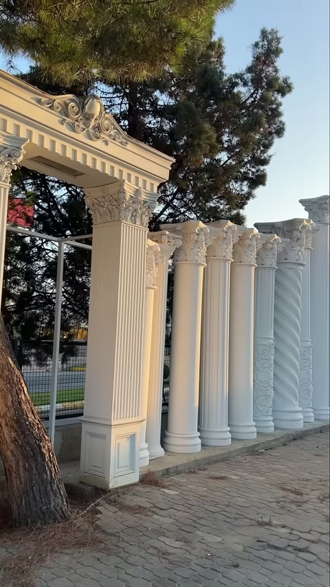 Outdoor display of straight and twisted column shaft models lined up