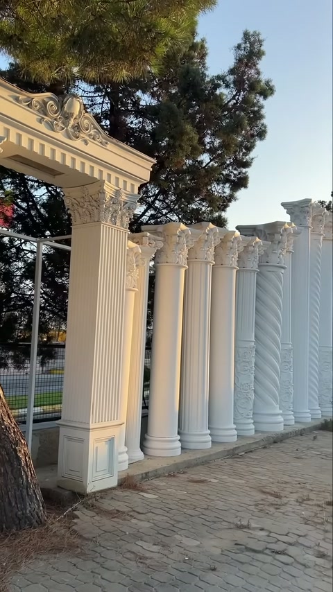 Arrangement of fluted columns beneath an ornamental upper beam