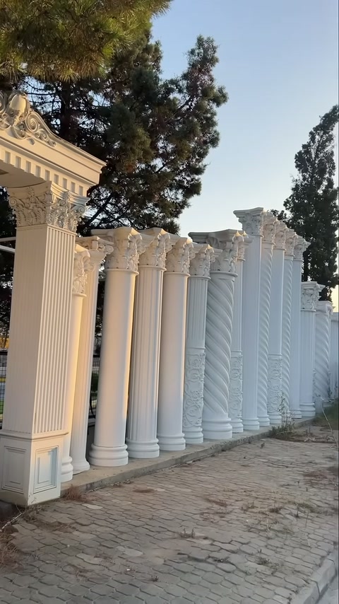 Round decorative columns extending from classical entrance frame