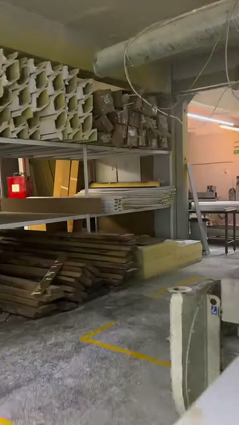 Column ornaments, panels, and various production materials are stored on shelves.