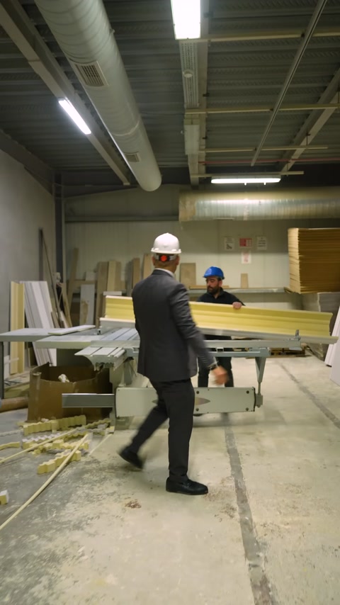 Decorative profiles are processed at a cutting bench in the workshop
