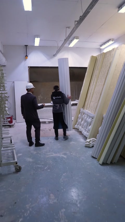 Columns and various decorative components are waiting in the painting section