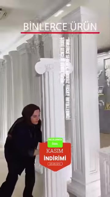 Fluted columns and decorative capitals in the showroom are examined