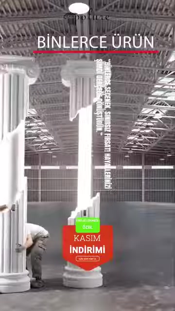 Fluted column shafts lined up in the production area are shown together