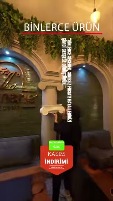 A restaurant corner arranged with curved arches and classical columns is shown.
