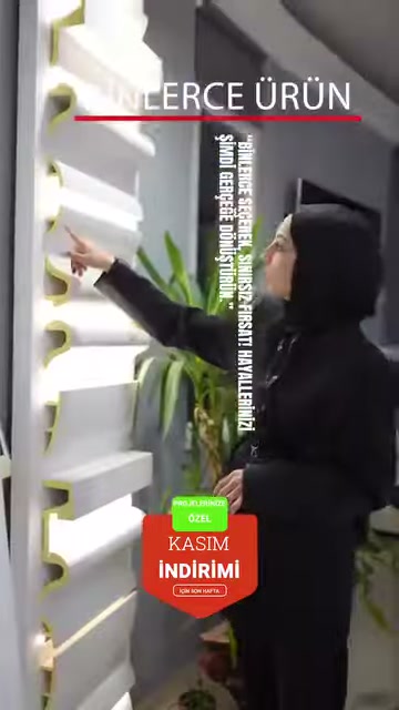 Rows of white profile cross-sections on a wall display are explained with pointing.