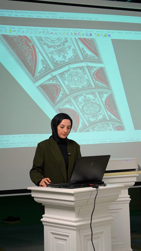 Presenter continues explaining curved ceiling molding project