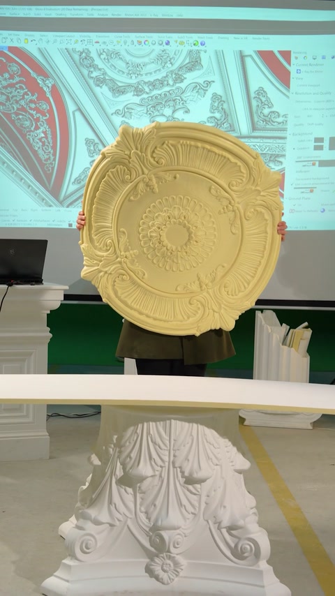 Round decorative ceiling rosette held up on production table
