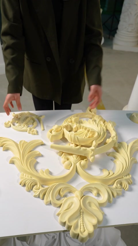 Several finished decorative pieces laid out on table
