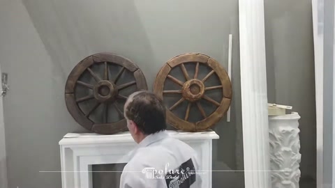 Dark and brown wheel models standing side by side on the showroom fireplace