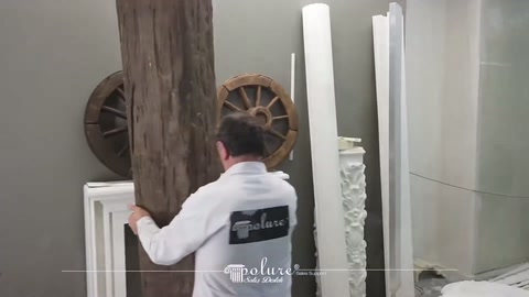 Wide surface of a vertical decorative beam displayed in the showroom