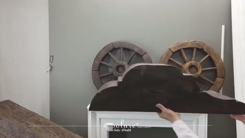 Server carrying a hollowed decorative log piece horizontally