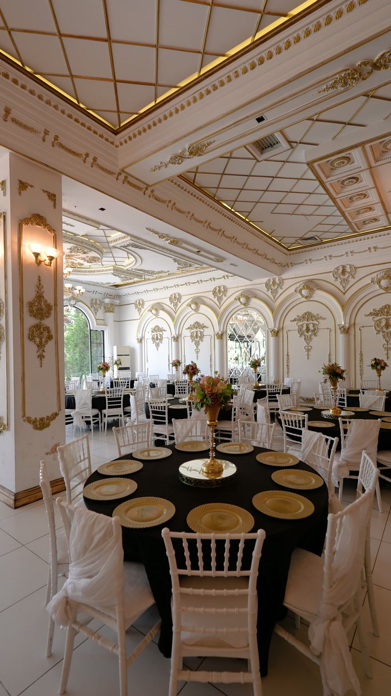 Wedding Ballroom Ceiling Decor with Gold Mouldings and Chandeliers