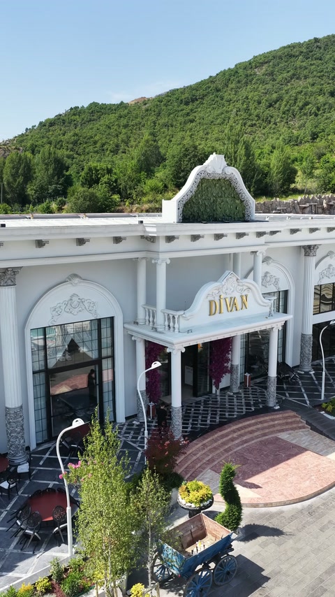 Wedding venue exterior displays columns, arches and decorative facade elements