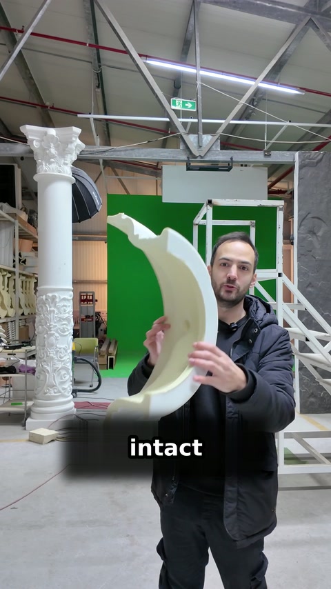 Presenter rotates the moulding to reveal its inner curved surface