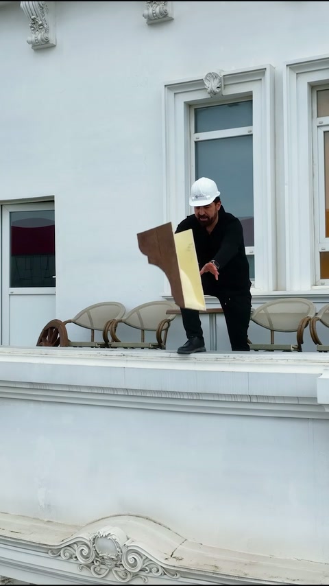 Craftsman prepares door surround cladding piece for a classical facade