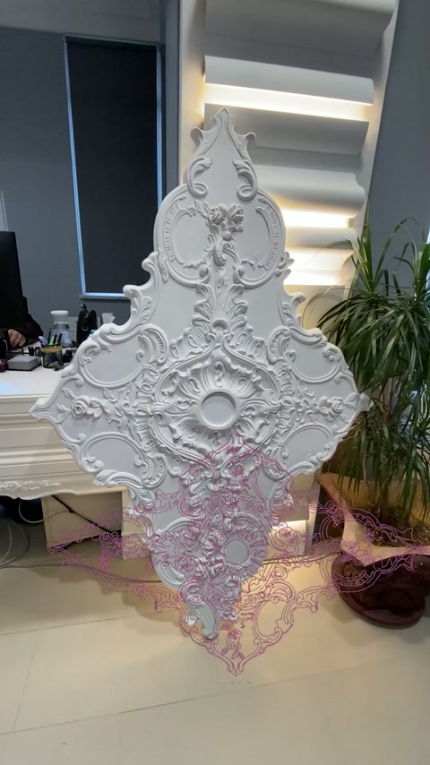 Ornate large ceiling rose is displayed vertically in the interior
