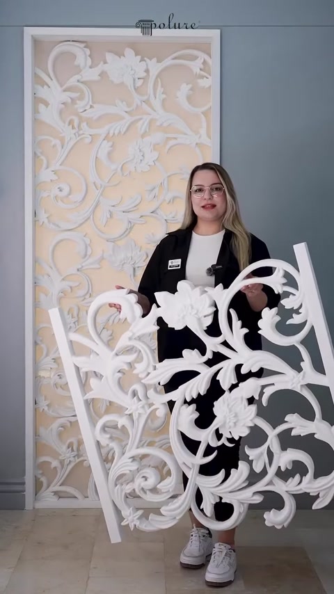 The complete form of the white patterned cut-out panel is shown in close-up