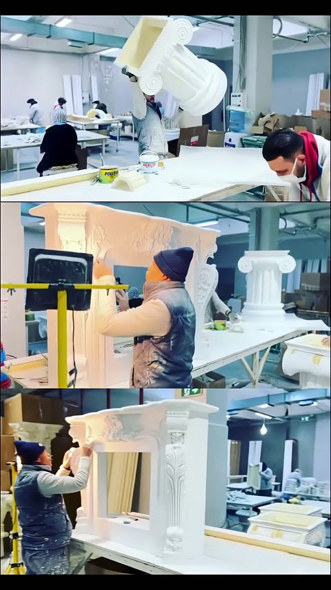 Piano del tavolo e basi a forma di colonna in lavorazione in officina