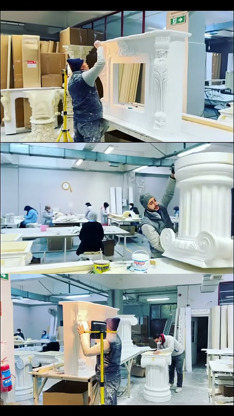 Craftsman working on the top edge of a large column-detailed table frame in the workshop