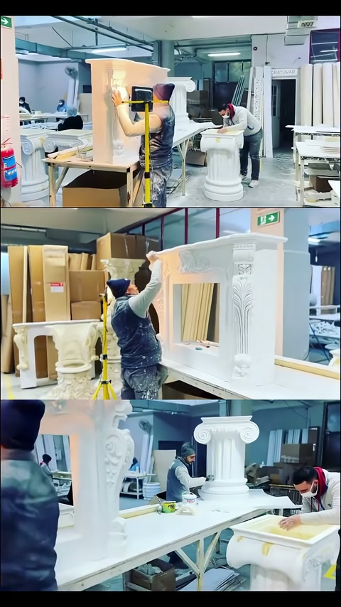 Craftsman carefully working on carved corner details in the table body