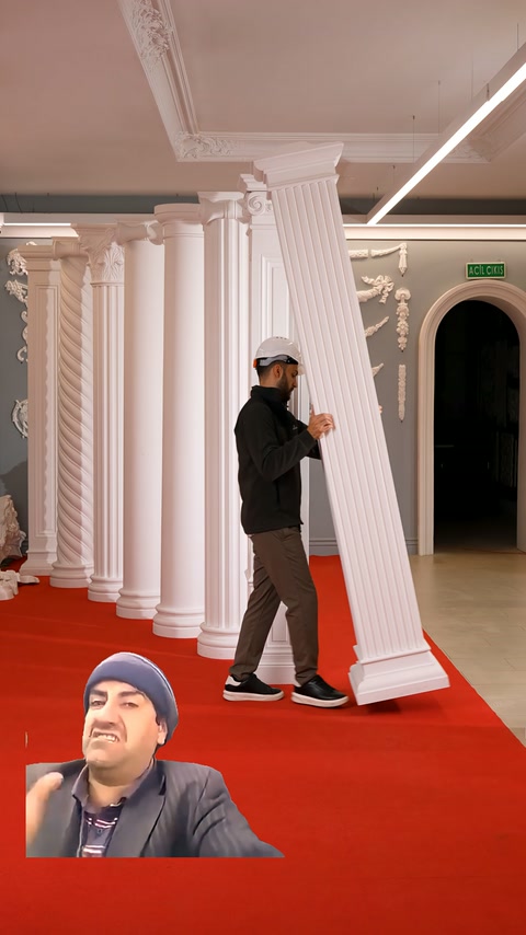 Fluted square pilaster is held from the body and presented in the exhibition space.