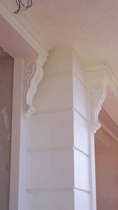 Close-up of fluted column capital with ornamental polyurethane details