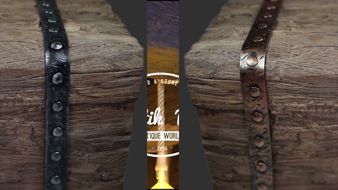 Vertical wood-look log decorated with metal beam band