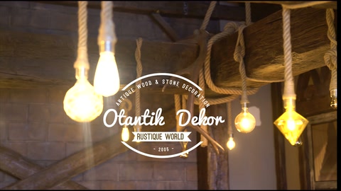 Rustic ceiling arrangement showing beams and colored pendant lights