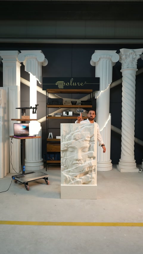 Video shows a presenter demonstrating an embossed relief panel in the workshop.
