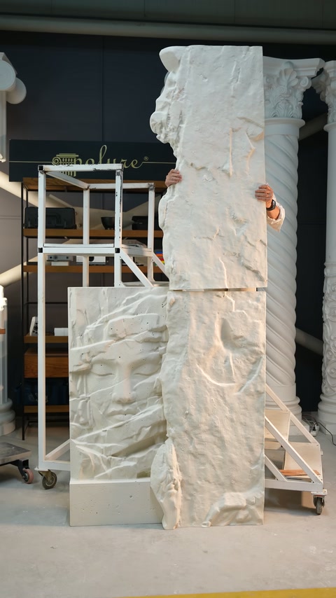 Embossed modules are elevated to reveal the integrated wall arrangement.